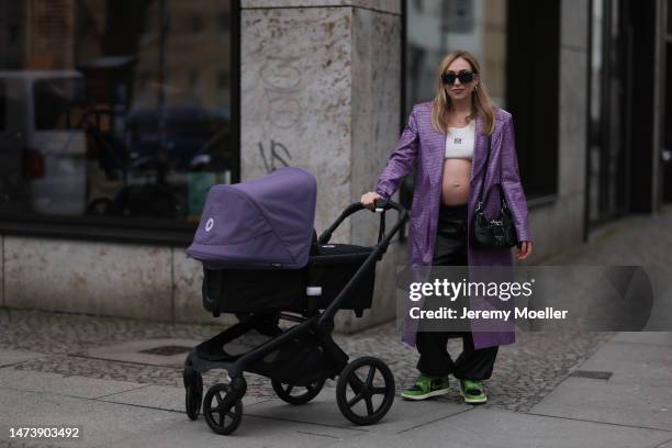 Sonia Lyson seen wearing Prada Moon black leather bag, Carolina Herrera black sparkling sunglasses, Nike green and black Air Jordan leather sneaker,...