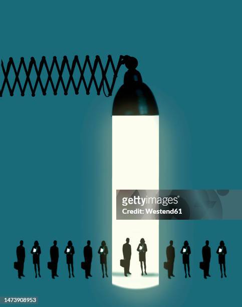 line of people standing under beam of oversized desk lamp - schreibtischlampe stock-grafiken, -clipart, -cartoons und -symbole