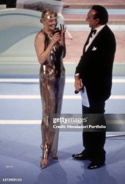 Italian singer Anna Oxa and the TV host Pippo Baudo during the first evening of the Italian Song Festival. Sanremo , February 23th, 1994