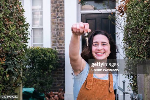 happy woman showing new home keys - house viewing stock pictures, royalty-free photos & images