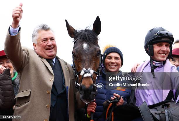 Trainer Paul Nicholls celebrates alongside Harry Cobden on board Stage Star after winning the Turners Novices Chase during day three of the...