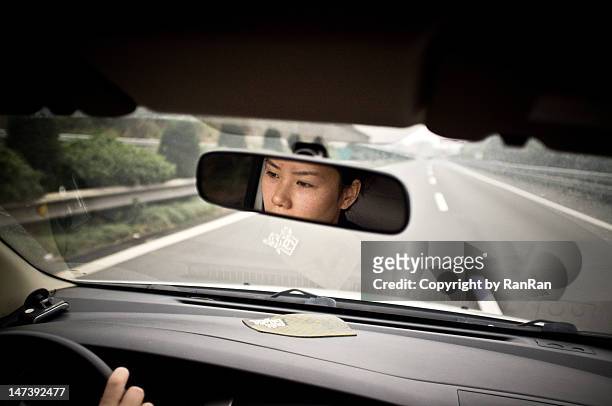 driving the car - rear view mirror stock pictures, royalty-free photos & images