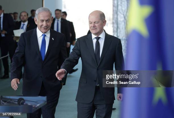 German Chancellor Olaf Scholz and Israeli Prime Minister Benjamin Netanyahu arrive to speak to the media following talks at the Chancellery on March...