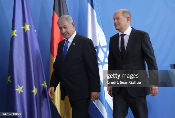 German Chancellor Olaf Scholz and Israeli Prime Minister Benjamin Netanyahu depart after speaking to the media following talks at the Chancellery on...