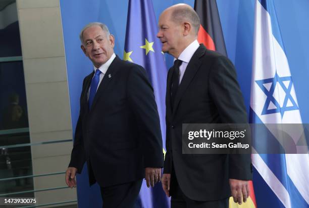 German Chancellor Olaf Scholz and Israeli Prime Minister Benjamin Netanyahu depart after speaking to the media following talks at the Chancellery on...