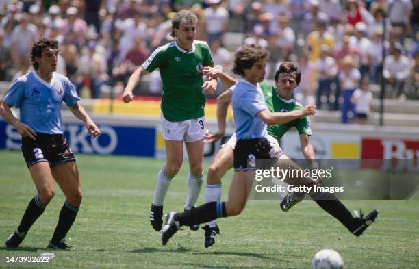 West Germany striker Klaus Allofs shoots to score the Germany goal as team mate Rudi Voeller looks on during the 1986 FIFA World Cup match between...