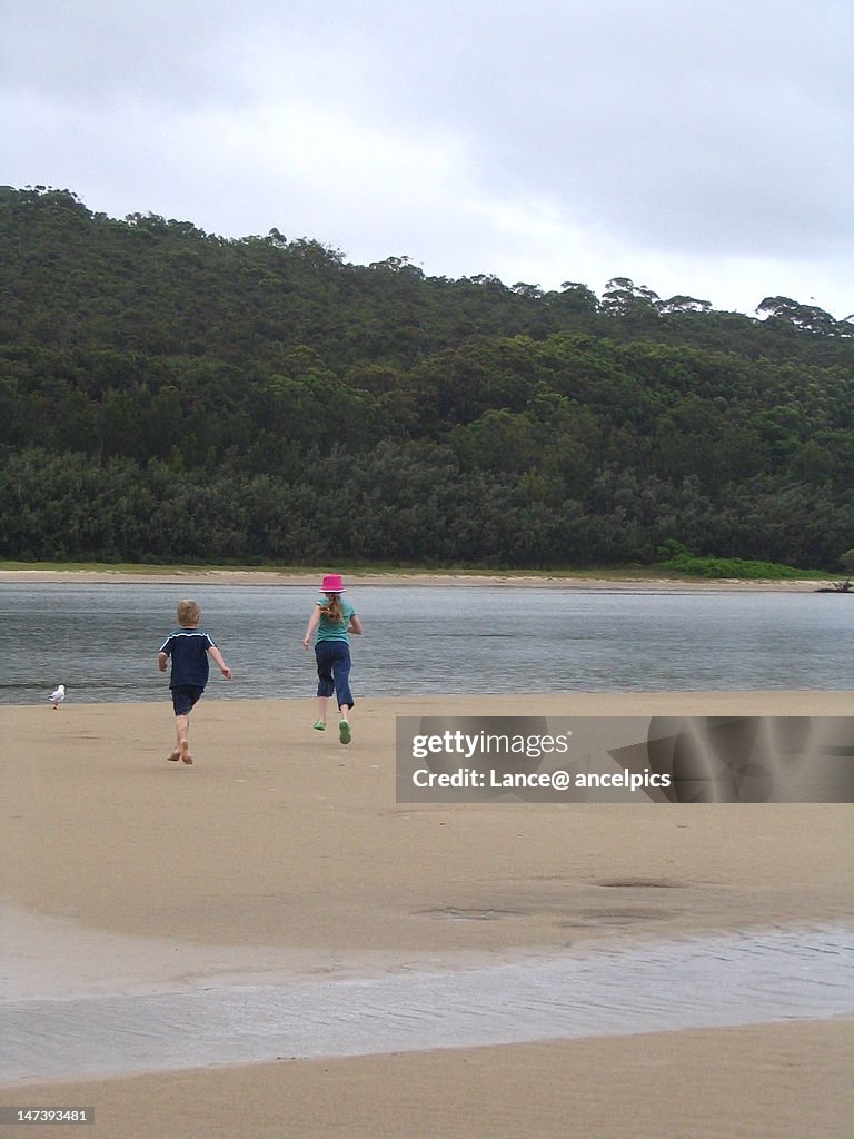 Children running near river