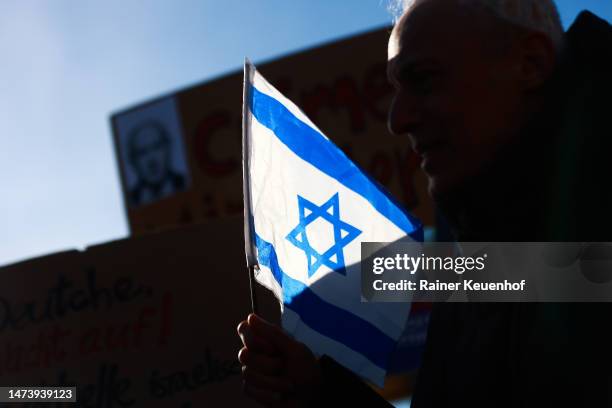 People demonstrate and waving israeli flags at the Brandenburg Gate during the visit of Israeli Prime Minister Benjamin Netanyahu against possible...