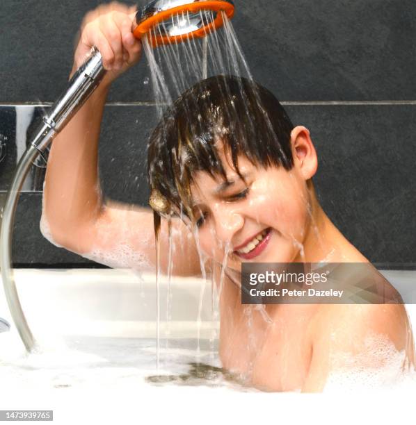 washing hair in bath - bathroom home people shower stock pictures, royalty-free photos & images