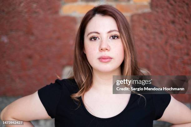 young caucasian latino woman looking at the camera, close-up - smart casual look stock pictures, royalty-free photos & images