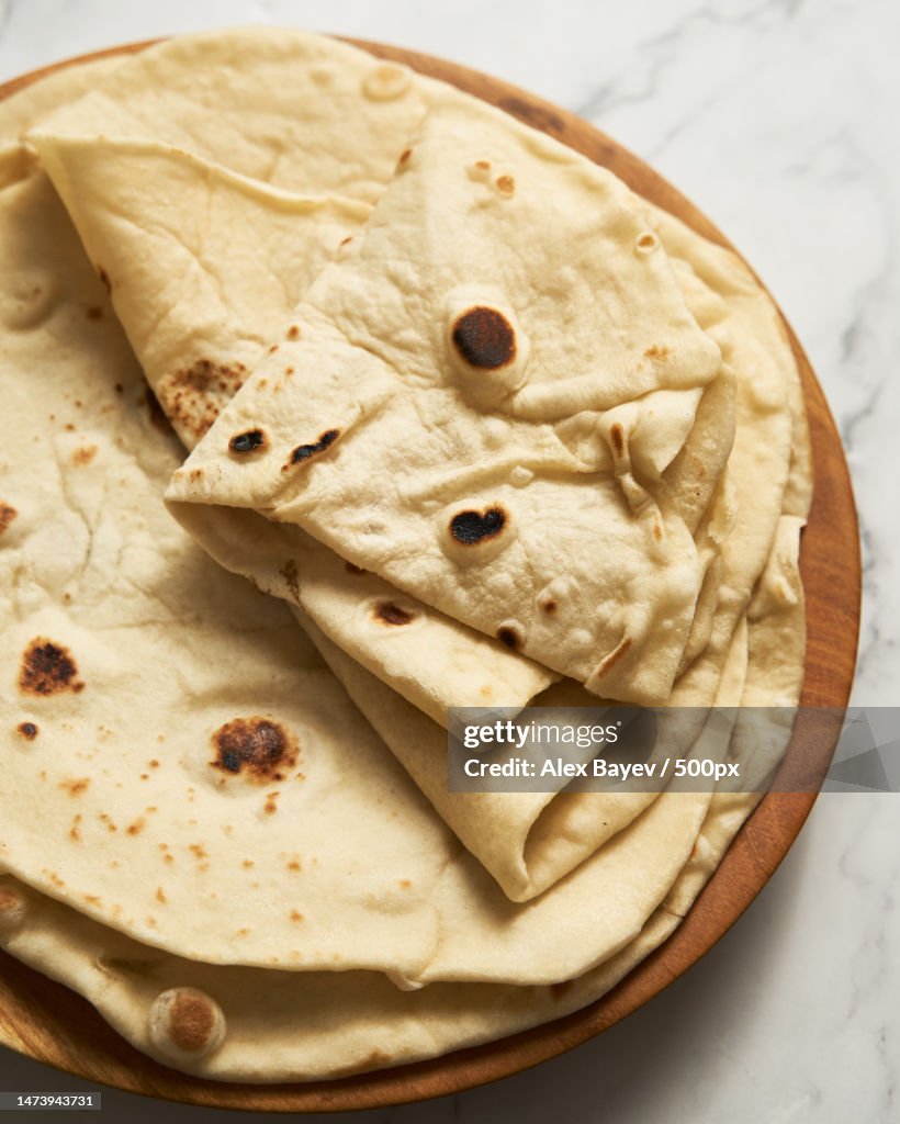 Soft lavash bread on white background Homemade freshy baked lavash