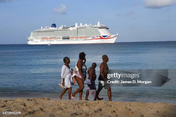Locals watch as P&O Cruises newest ship Arvia arrives close to Heywoods Beach on March 16, 2023 in Bridgetown, Barbados. Nicole Scherzinger will...