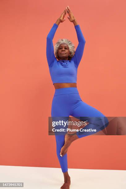 senior woman exercising - senior yoga lady stock pictures, royalty-free photos & images
