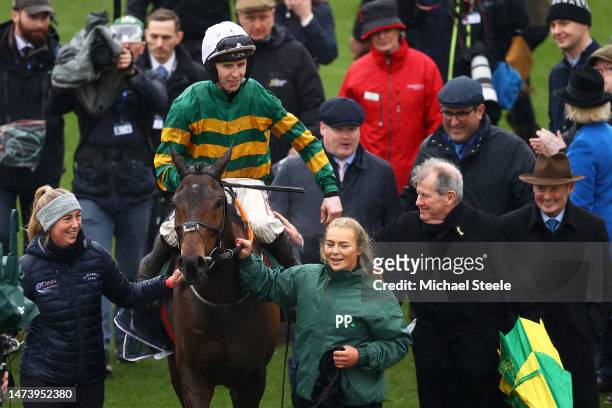 Mark Walsh celebrates on board Sire Du Berlais and alongside Owner JP McManus and Trainer Gordon Elliott after winning the Paddy Power Stayers Hurdle...