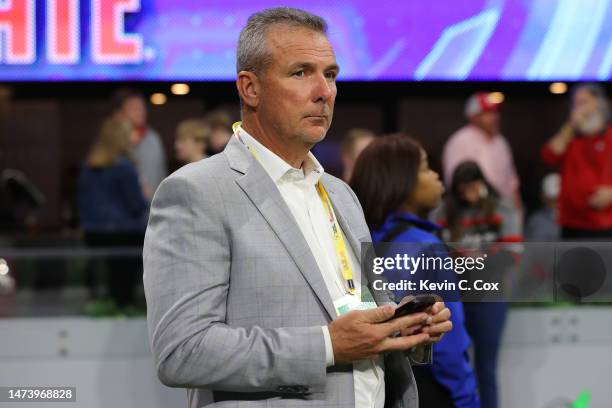 Urban Meyer looks on during the first round game of the NCAA Men's Basketball Tournament between the West Virginia Mountaineers and the Maryland...