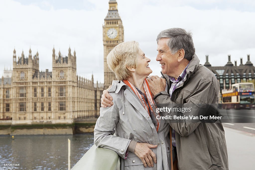 Couple embracing, Big Ben in background.