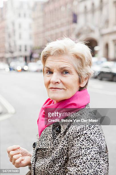 portrait of mature woman in city. - city 70's stock pictures, royalty-free photos & images