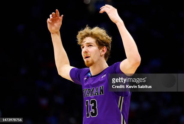 Garrett Hien of the Furman Paladins reacts against Virginia Cavaliers during the second half in the first round of the NCAA Men's Basketball...