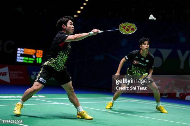 Takuro Hoki and Yugo Kobayashi of Japan compete in the Men's Doubles second round match against Alexander Dunn and Adam Hall of Scotland on day three...