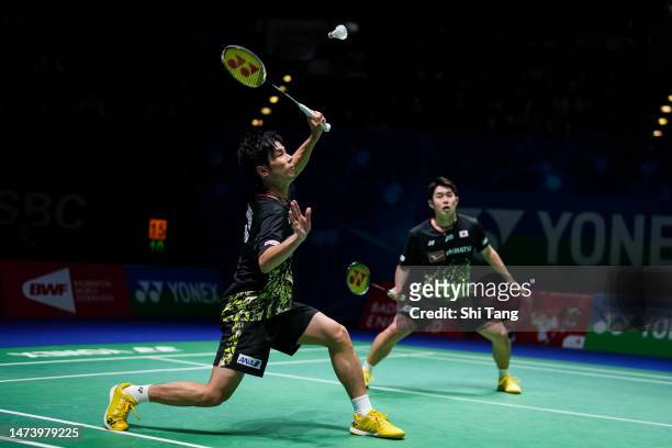 Takuro Hoki and Yugo Kobayashi of Japan compete in the Men's Doubles second round match against Alexander Dunn and Adam Hall of Scotland on day three...