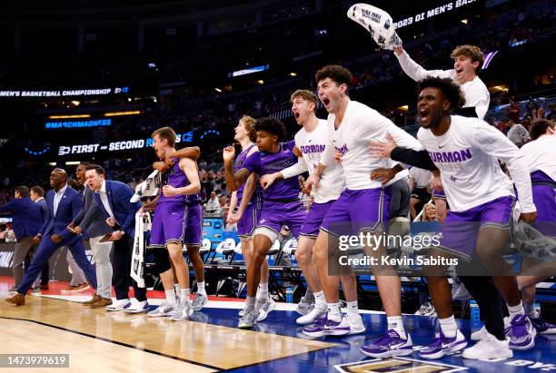 The Furman Paladins bench react against Virginia Cavaliers during the second half in the first round of the NCAA Men's Basketball Tournament at Amway...