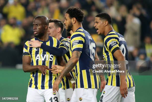 Enner Valencia of Fenerbahce celebrates with Joshua King and team mates after scoring the team's first goal from a penalty kick during the UEFA...