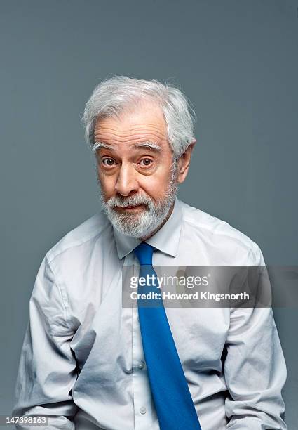 mature man portrait looking questioning - raised eyebrows stockfoto's en -beelden