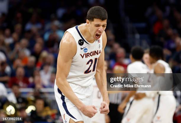 Kadin Shedrick of the Virginia Cavaliers celebrates against the Furman Paladins during the second half in the first round of the NCAA Men's...
