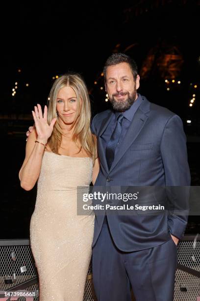 Jennifer Aniston and Adam Sandler attend the "Murder Mystery 2" photocall at Pont Debilly on March 16, 2023 in Paris, France.