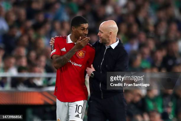 Erik ten Hag, Manager of Manchester United, speaks with his player Marcus Rashford during the UEFA Europa League round of 16 leg two match between...
