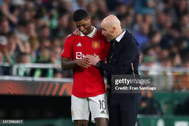 Erik ten Hag, Manager of Manchester United, speaks with his player Marcus Rashford during the UEFA Europa League round of 16 leg two match between...