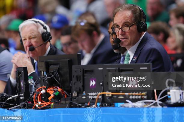 Commentators Jim Nantz and Bill Raftery look on during the first round of the NCAA Men's Basketball Tournament game between the West Virginia...