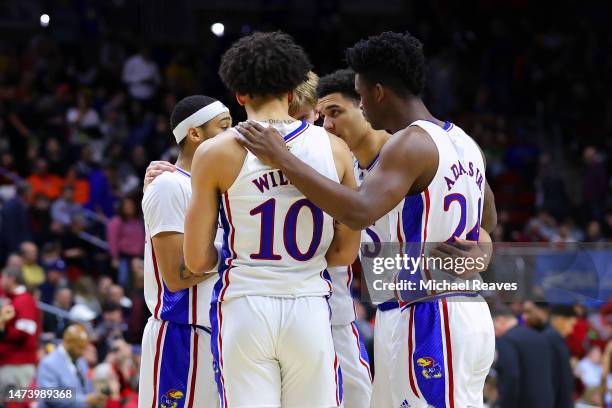 Players of the Kansas Jayhawks huddle during half time in the first round of the NCAA Men's Basketball Tournament at Wells Fargo Arena on March 16,...