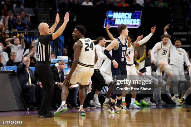 Kobe Brown of the Missouri Tigers celebrates a three point basket against the Utah State Aggies during the second half in the first round of the NCAA...