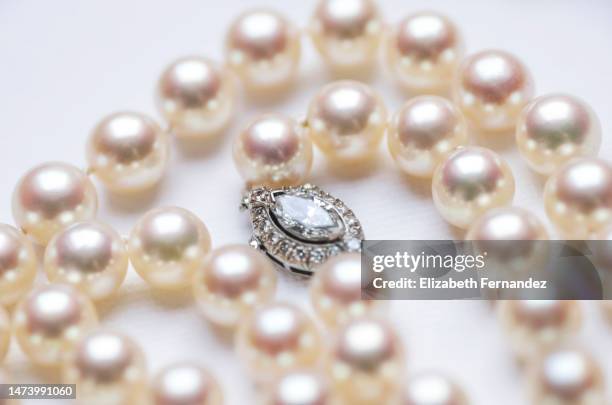 beautiful diamond clasp on pearl necklace - pearl necklace stock pictures, royalty-free photos & images
