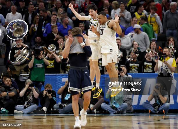 Jackson Francois and Nick Honor of the Missouri Tigers celebrates after defeating the Utah State Aggies in the first round of the NCAA Men's...
