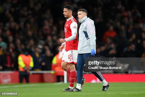 William Saliba of Arsenal leaves the pitch after picking up an injury during the UEFA Europa League round of 16 leg two match between Arsenal FC and...