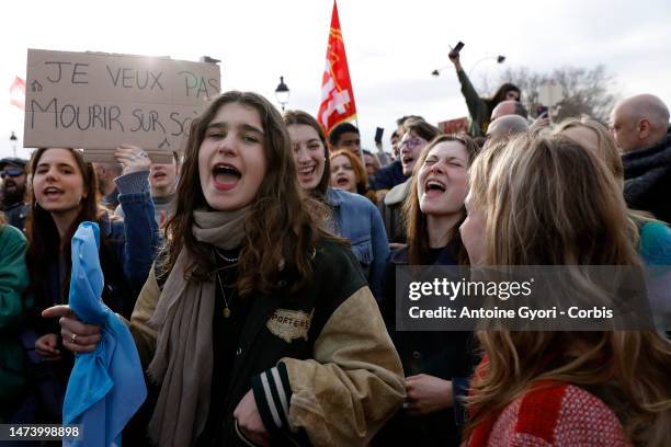 Students protest during a demonstration at Place de la Concorde, in front of the French National Assembly, after the French government bypass...