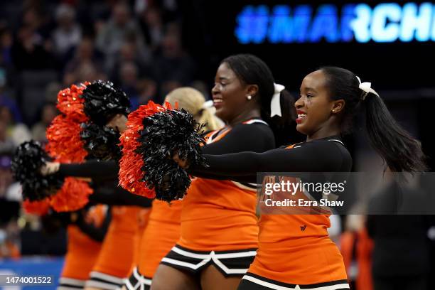 Princeton Tigers cheerleaders perform against the Arizona Wildcats during the first half in the first round of the NCAA Men's Basketball Tournament...