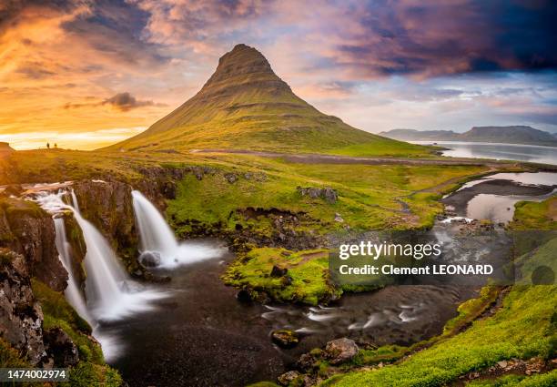 panorama of kirkjufell mountain and kirkjufellsfoss waterfall at sunset,  snaefellsnes peninsula, west iceland - snaefellsnes stock pictures, royalty-free photos & images