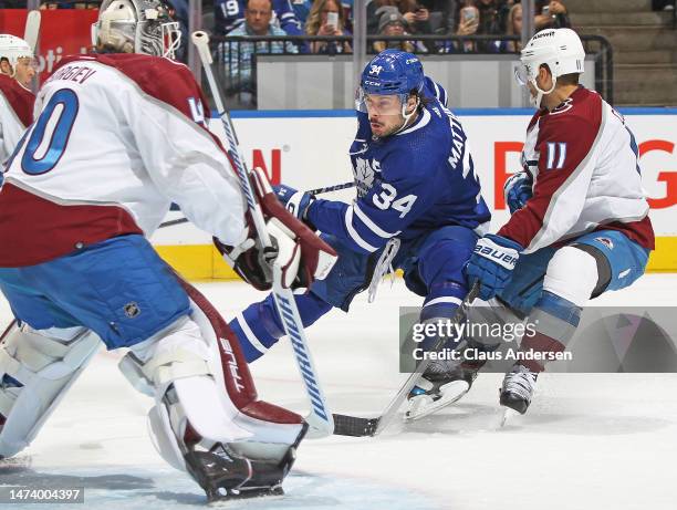 Andrew Cogliano of the Colorado Avalanche tries to cut a hard charging Auston Matthews of the Toronto Maple Leafs off from getting to the net during...