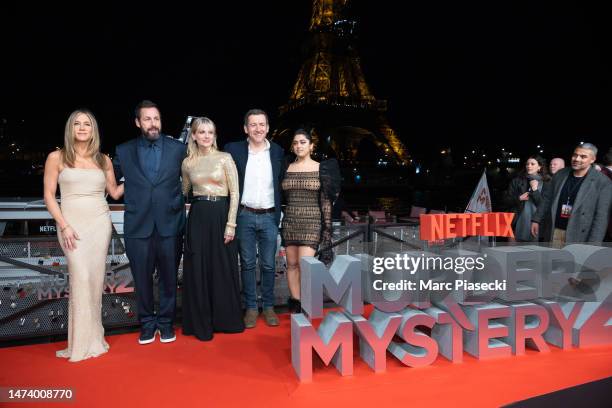 Jennifer Aniston, Adam Sandler, Melanie Laurent, Dany Boon and Kuhoo Verma attend the "Murder Mystery 2" photocall at Pont Debilly on March 16, 2023...