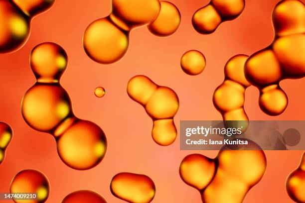 transparent glass yellow, gold molecules on red background. beauty 3d pattern. cosmetic products for makeup and skin care. collagen. - oily skin stock pictures, royalty-free photos & images