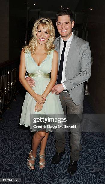 Michael Buble and Luisana Lopilato arrive at the Nordoff Robbins O2 Silver Clef Awards on June 29, 2012 in London, England.