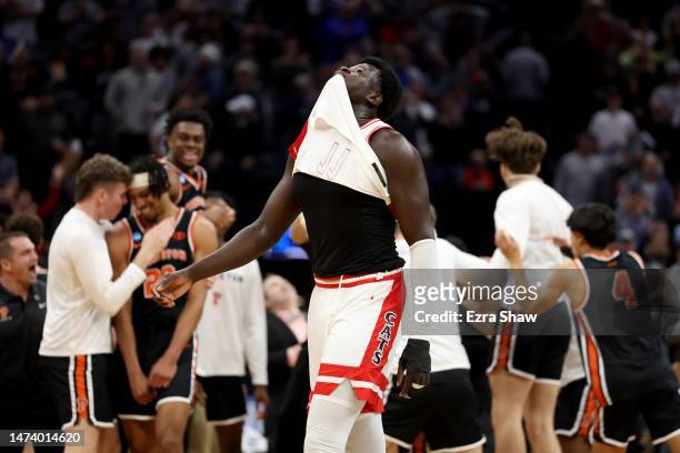 Oumar Ballo of the Arizona Wildcats reacts as the Princeton Tigers celebrate after defeating the Arizona Wildcats in the first round of the NCAA...