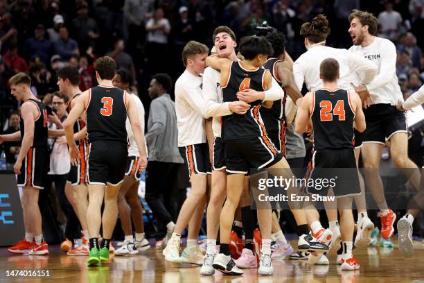 The Princeton Tigers celebrate after defeating the Arizona Wildcats in the first round of the NCAA Men's Basketball Tournament at Golden 1 Center on...