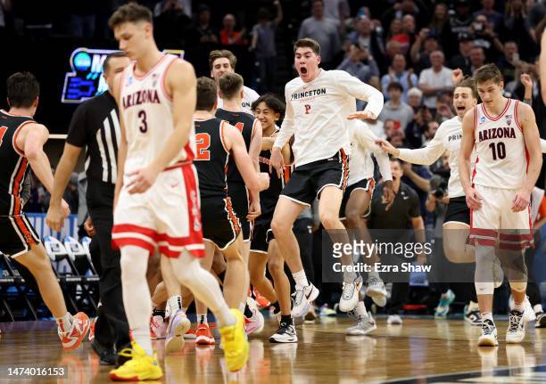 The Princeton Tigers celebrate after defeating the Arizona Wildcats in the first round of the NCAA Men's Basketball Tournament at Golden 1 Center on...