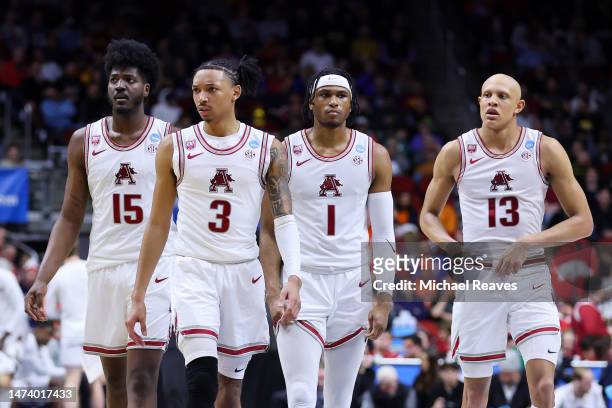Makhi Mitchell, Nick Smith Jr. #3, Ricky Council IV and Jordan Walsh of the Arkansas Razorbacks look on against the Illinois Fighting Illini during...