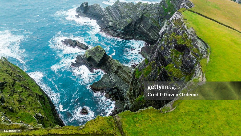 Cliffs in Ireland, Aerial view of Kerry Cliffs, Beautiful scenery of the Atlantic Ocean coastline, Ring of Kerry, Amazing wave lashed Kerry Cliffs, widely accepted as the most spectacular cliffs in County Kerry, Ireland, Atlantic ocean cliffs from above