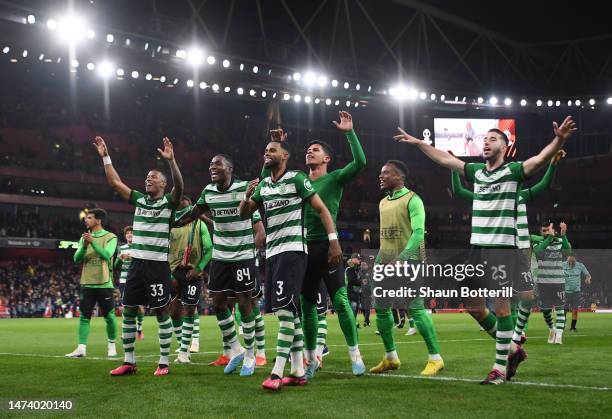 Players of Sporting CP celebrate their side's penalty shoot out victory in the UEFA Europa League round of 16 leg two match between Arsenal FC and...